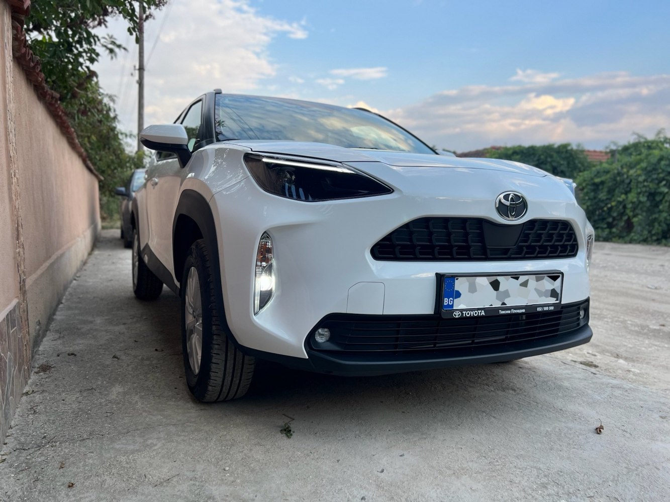 Front view showing sleek headlights and robust grille