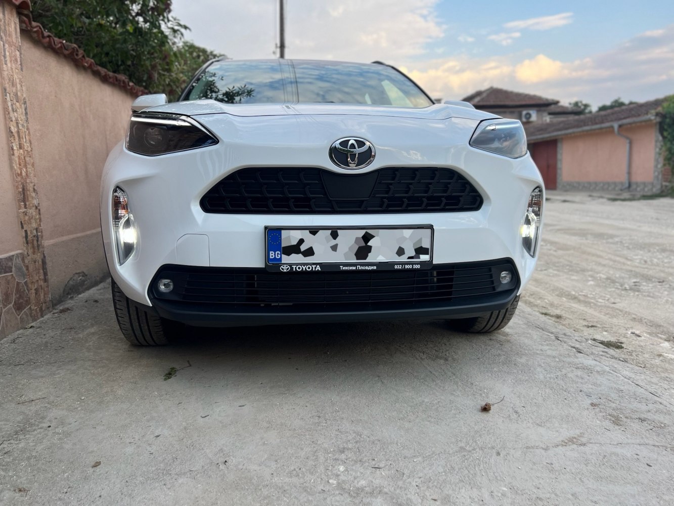 Front view including LED headlights and wide grille
