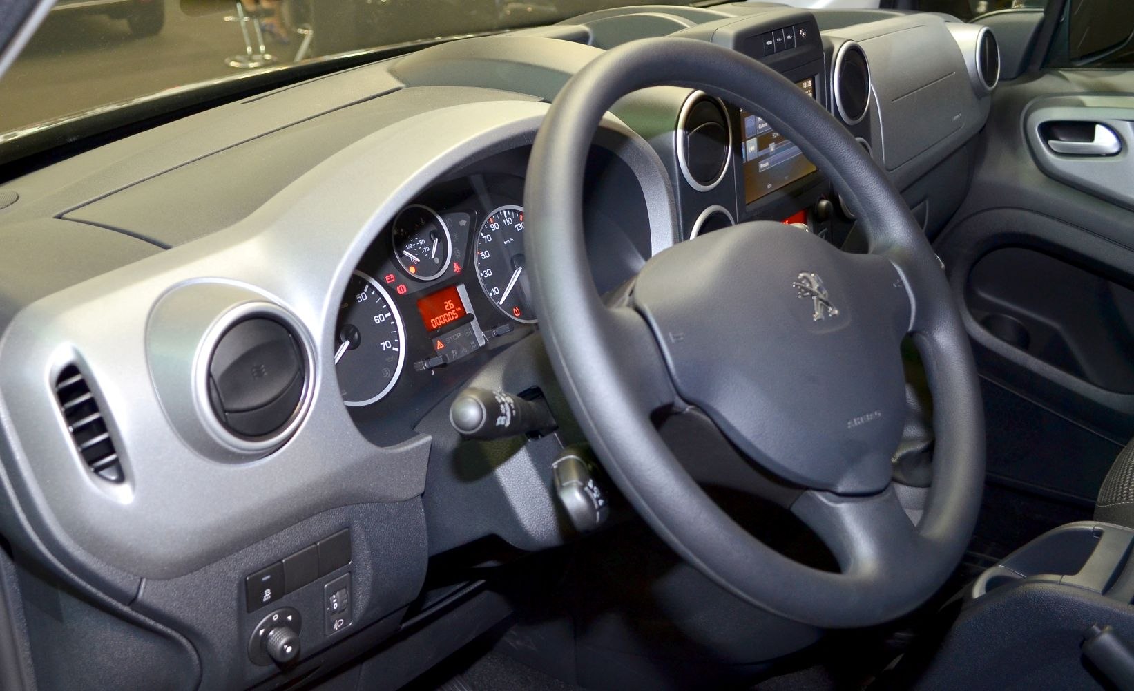 Steering wheel and dashboard with instrument cluster and air vents