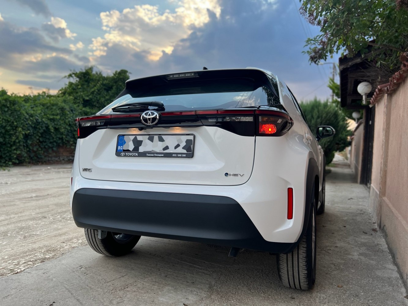 Rear view of a hybrid hatchback with distinctive taillights and modern design.