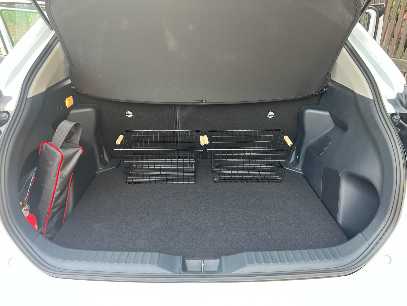 Spacious trunk with metal storage baskets and organized cargo space