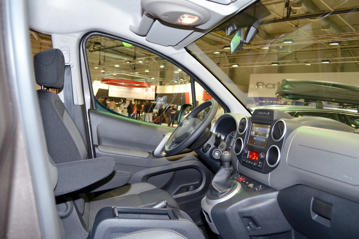 Interior dashboard and front seat with controls and armrest