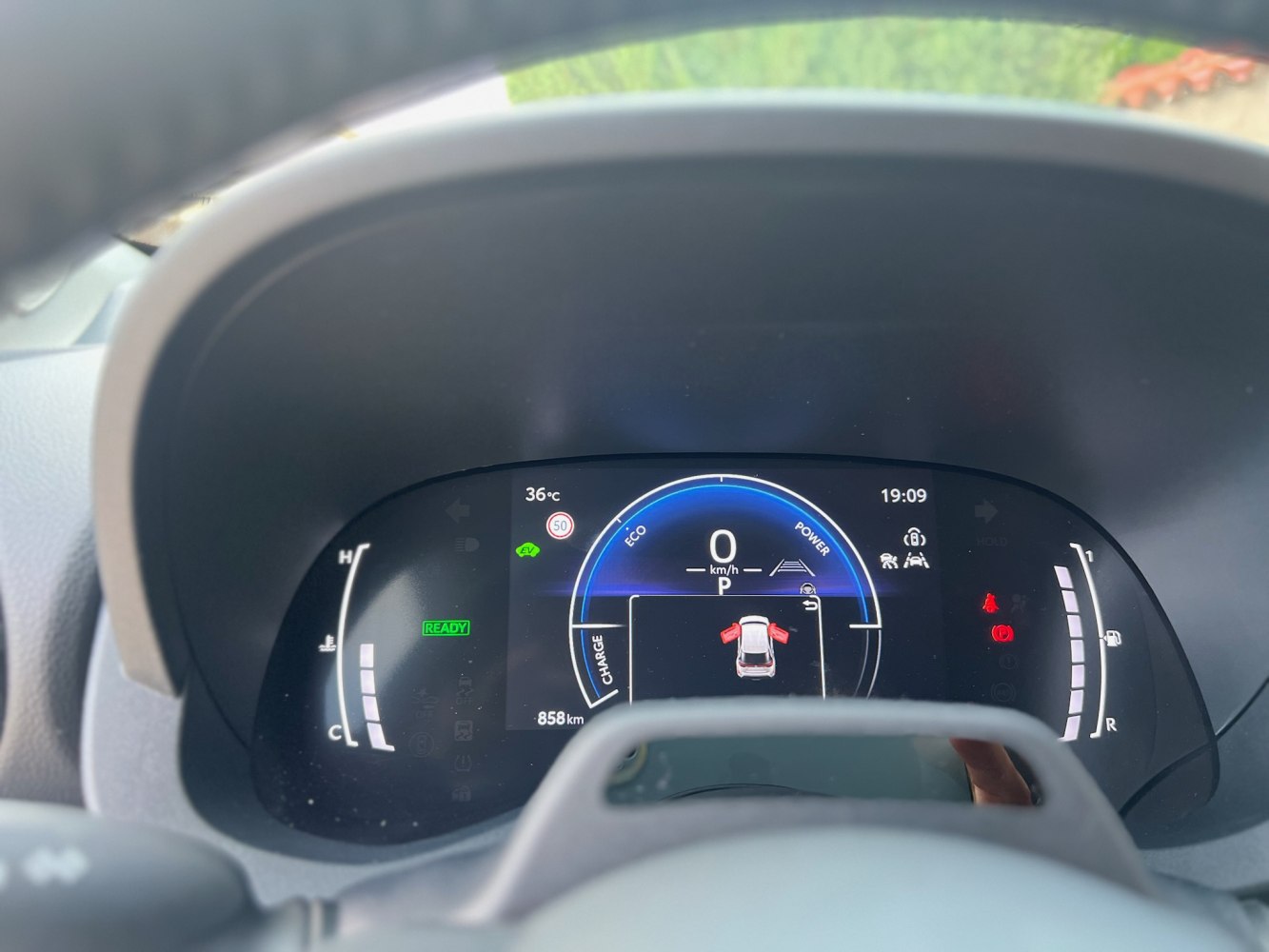 Modern digital instrument cluster displaying speed, eco mode, and vehicle status.