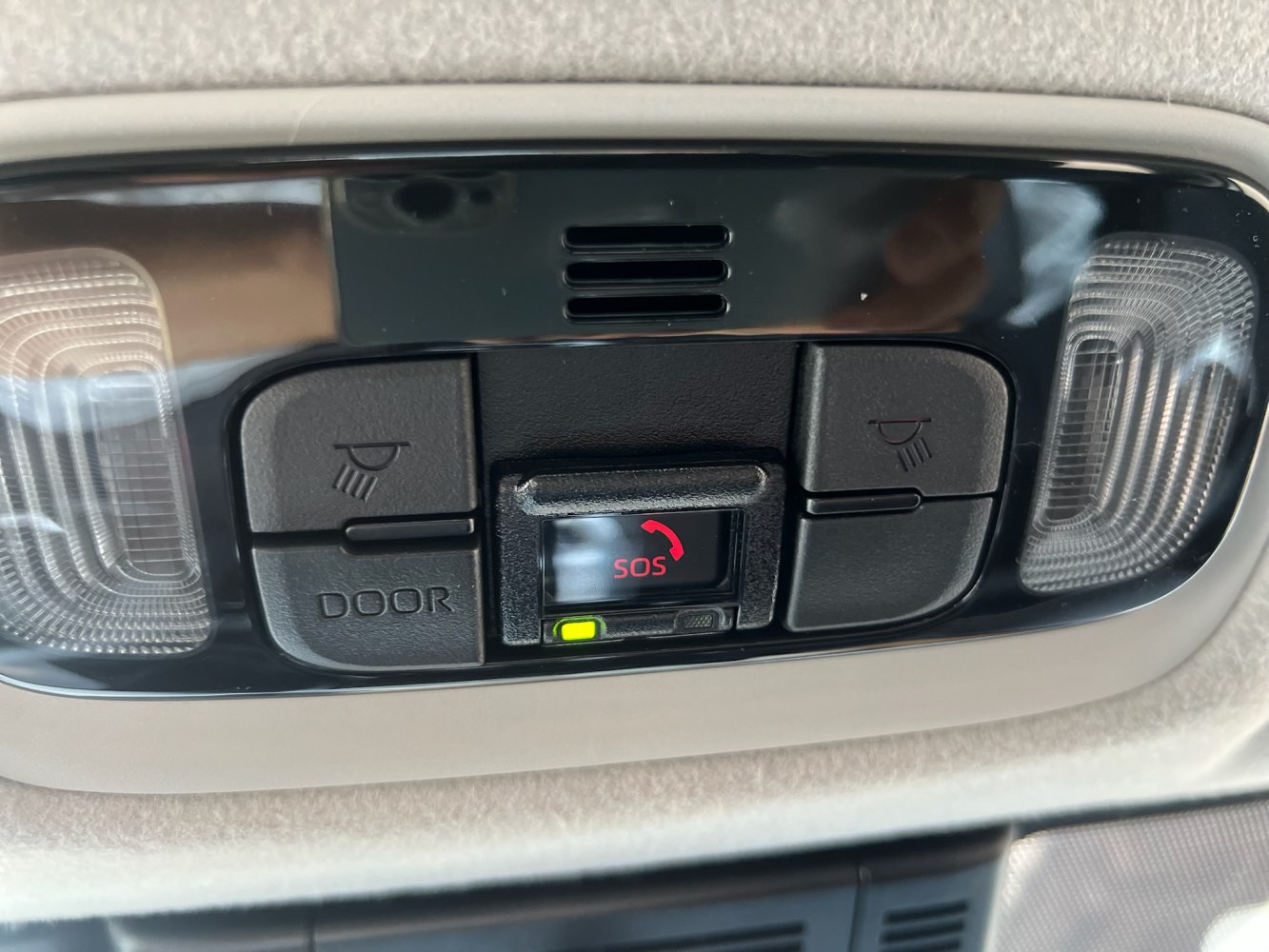 Overhead console with SOS emergency button and dual reading lights