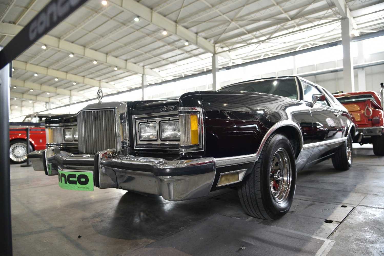 Classic 1970s muscle car front with chrome grille and dual rectangular headlights