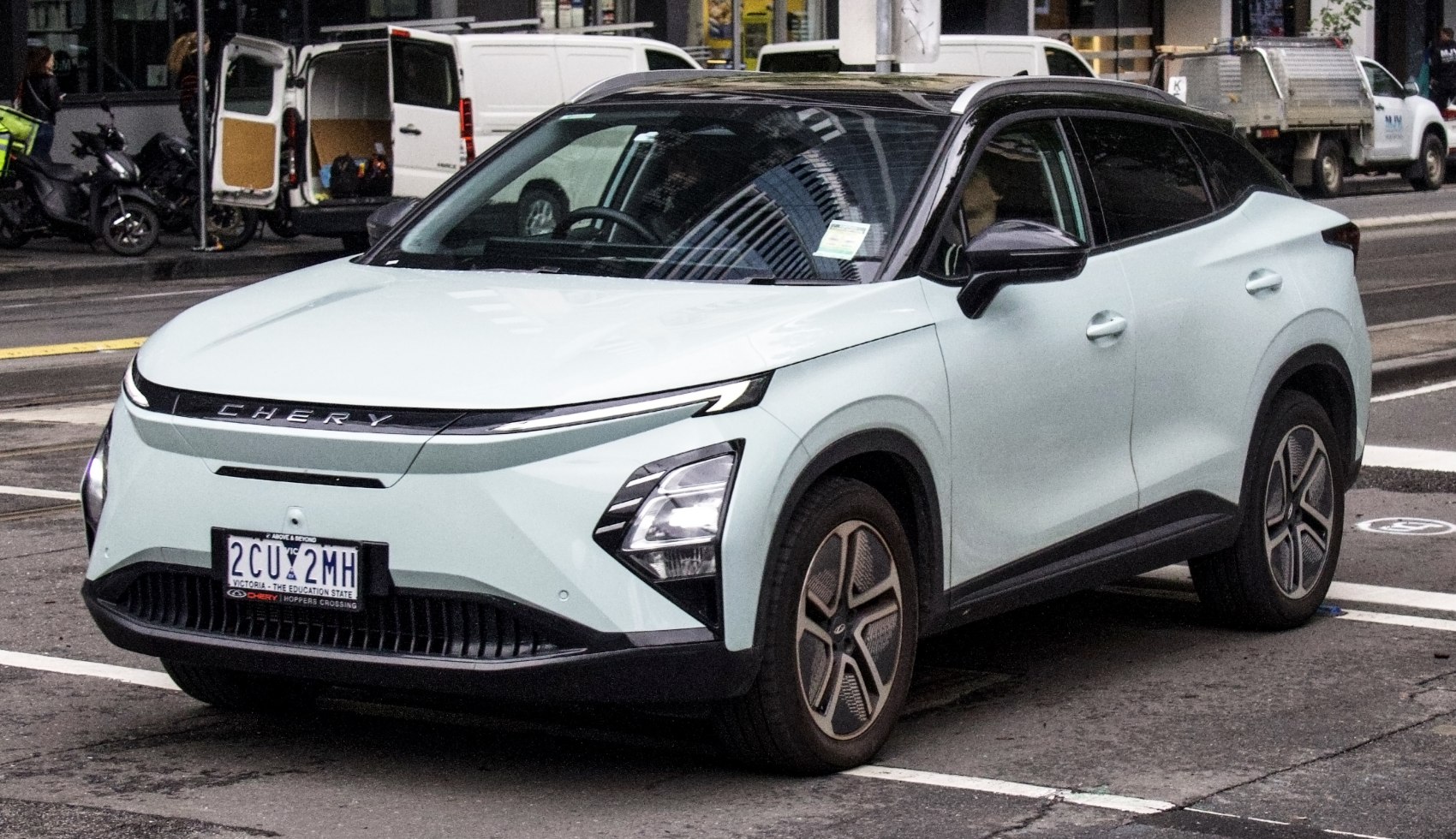Front and side view of a modern electric SUV with LED headlights.