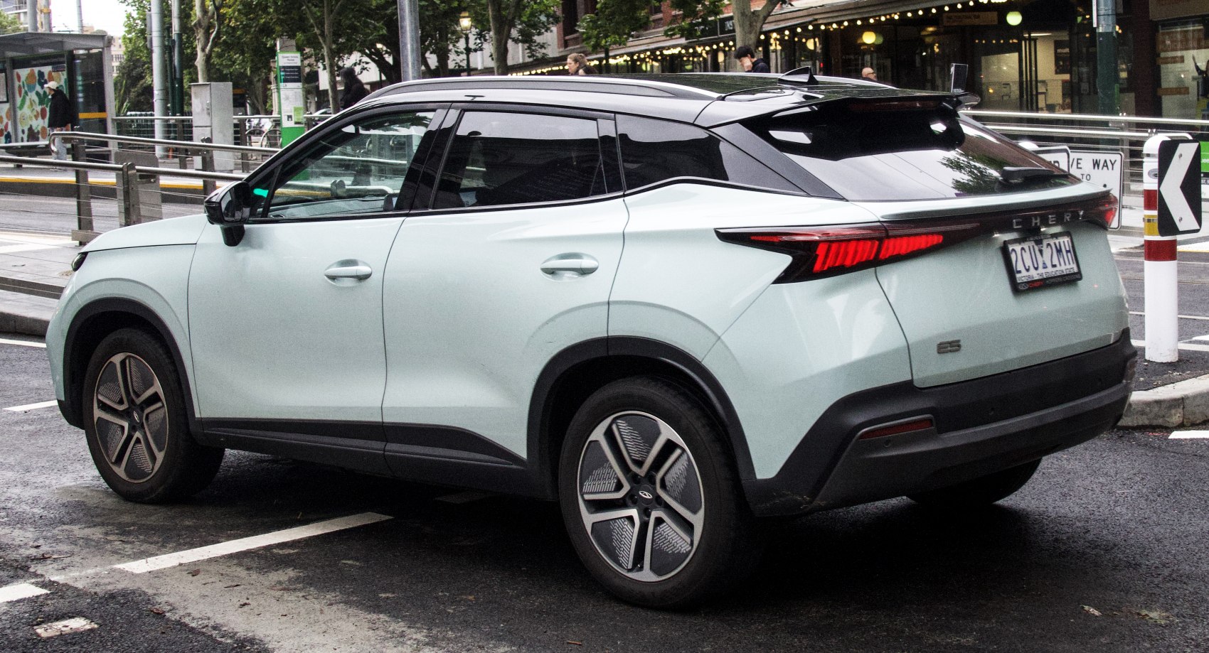 Rear side view of modern SUV with sharp taillights and alloy wheels