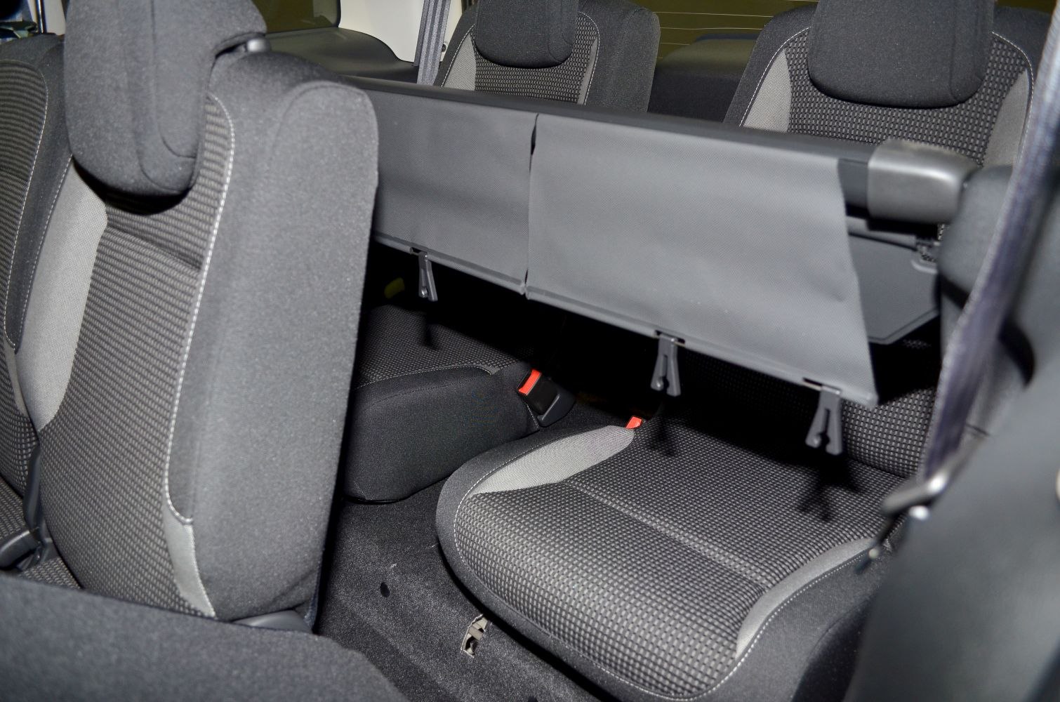 Rear passenger seats with installed privacy screen