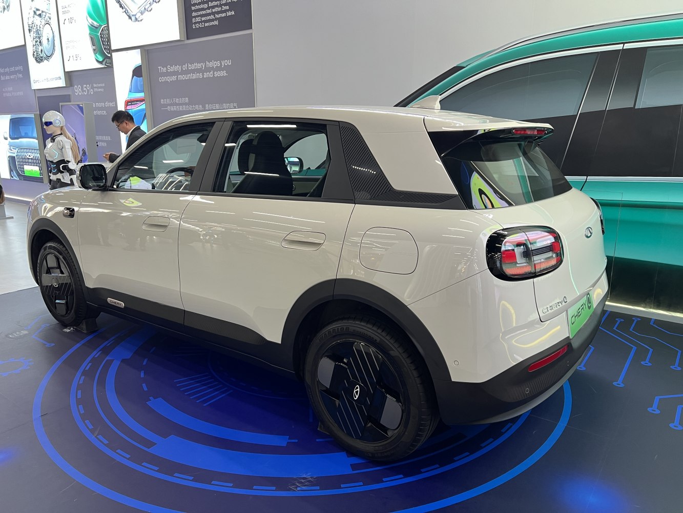 Rear side view of electric SUV with modern wheels and taillights