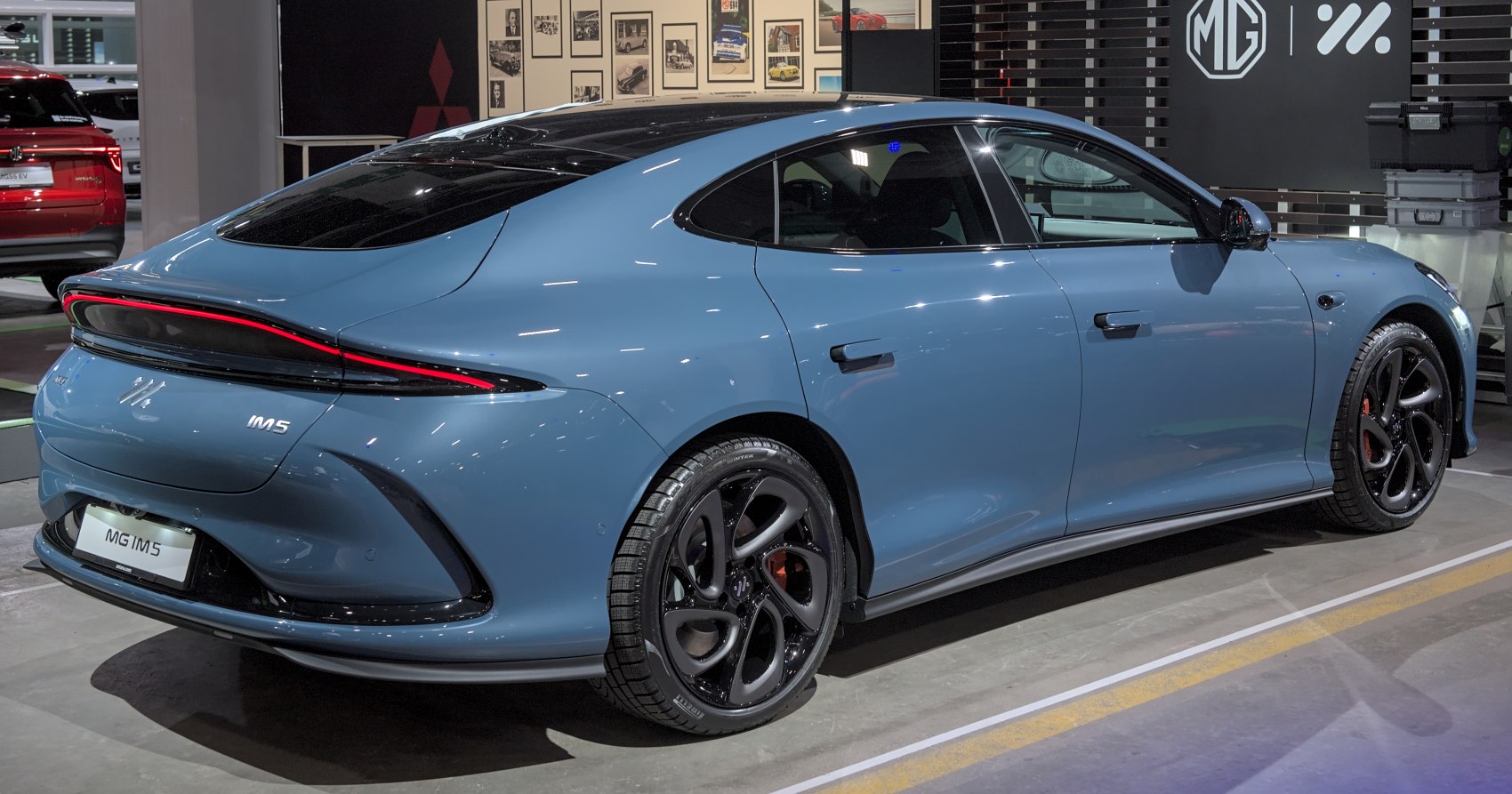 Rear aerodynamic design with full-width LED taillight and black multi-spoke alloy wheels