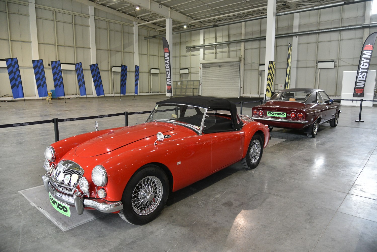 1950s convertible with wire spoke wheels and black soft top