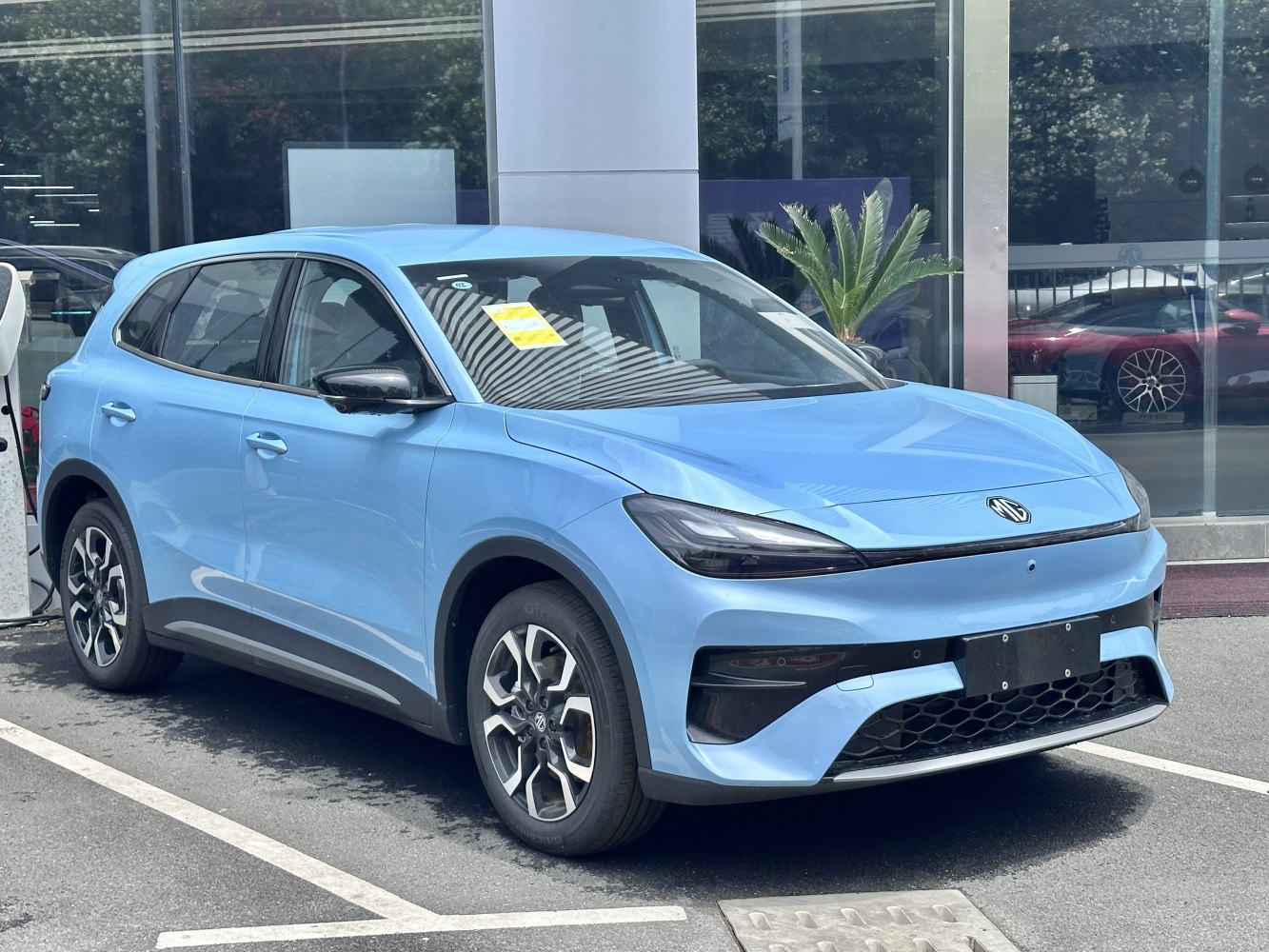 Front side view of modern electric SUV with sleek headlights