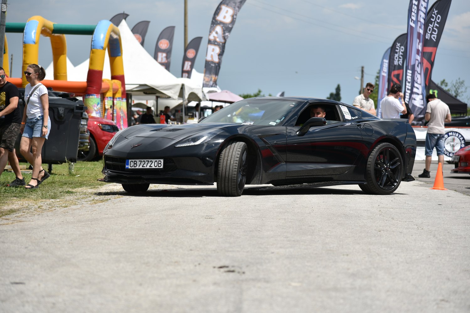 Black 2014 sports coupe with sharp front design and aggressive stance