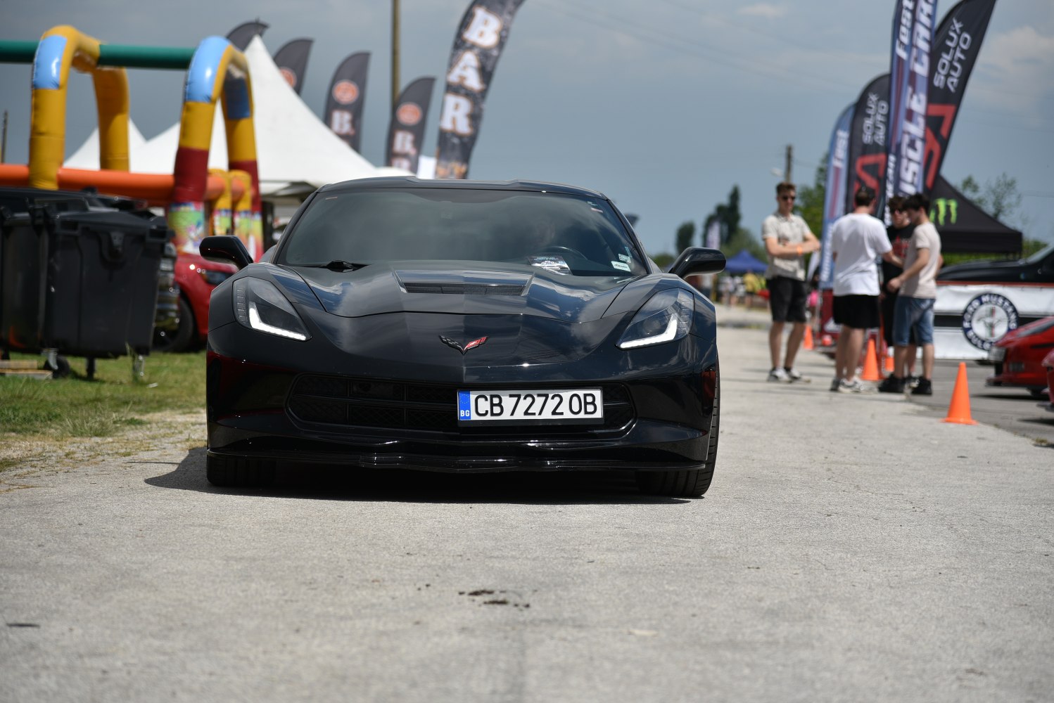 Front view of sports car with LED headlights and aerodynamic hood