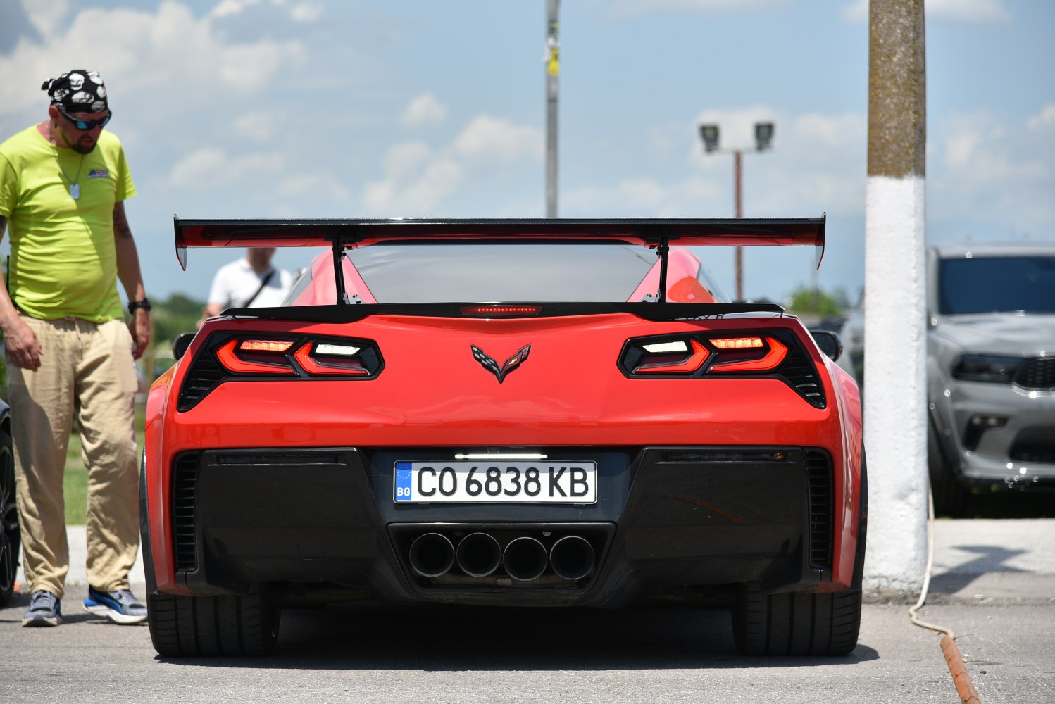 Rear view with distinctive taillights and large racing spoiler
