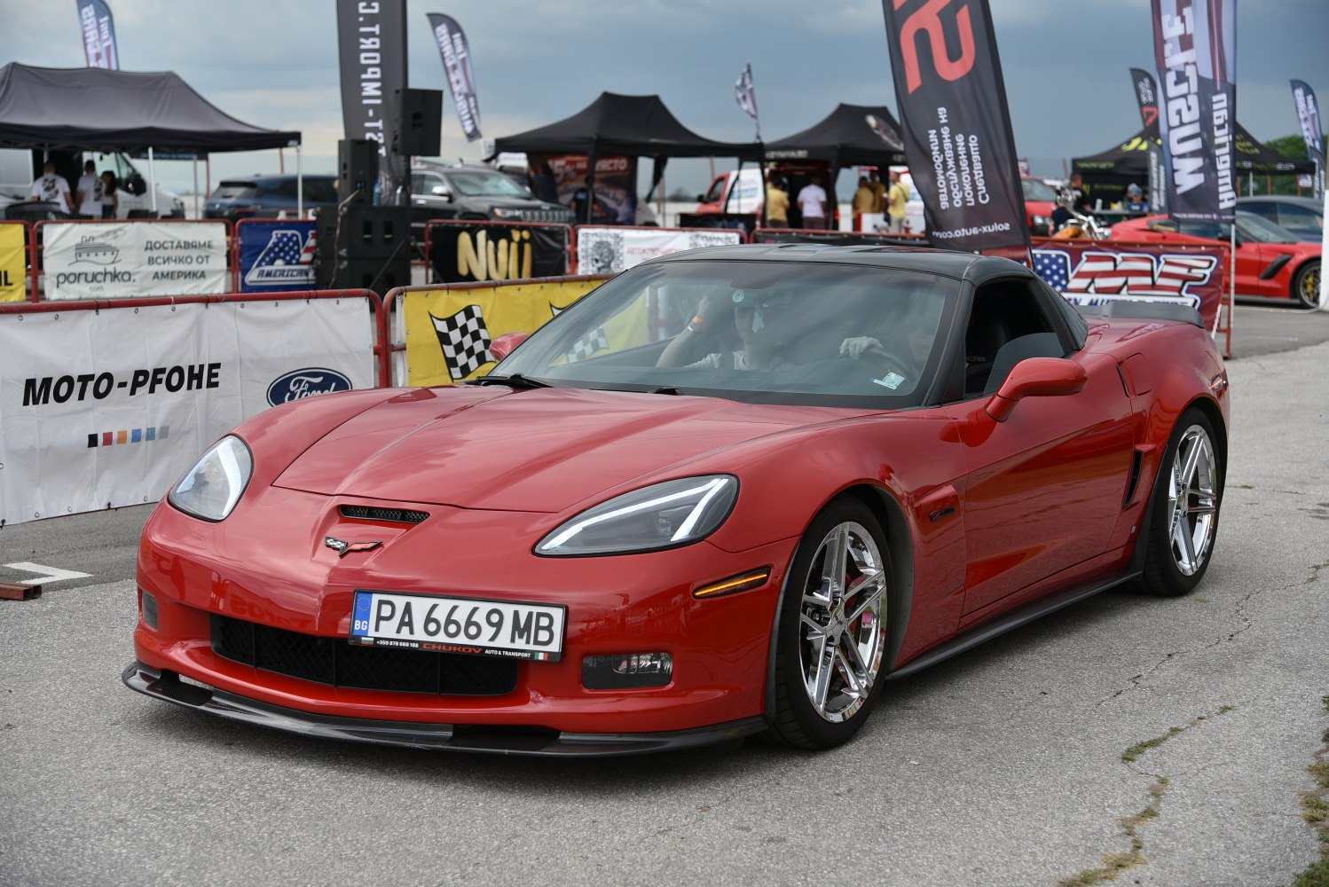 Sleek aerodynamic front with sharp headlights and chrome wheels
