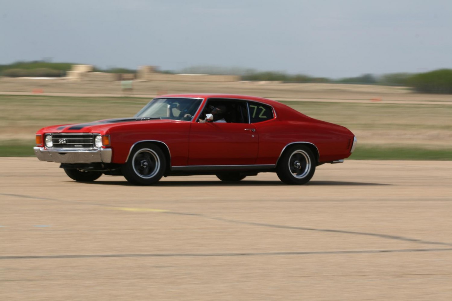 SS front grille and two-door sport coupe profile with racing stripes
