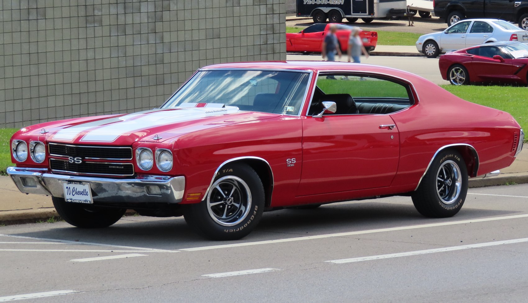 Red muscle coupe with racing stripes and SS 396 emblem