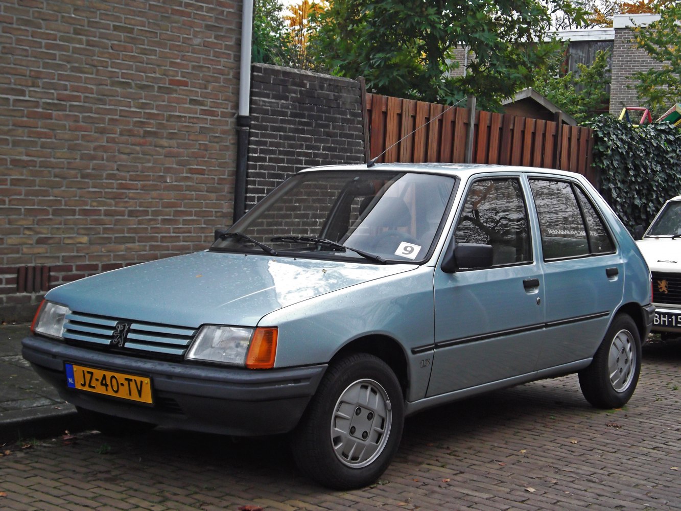 1980s blue compact hatchback with alloy wheels and clean vintage styling