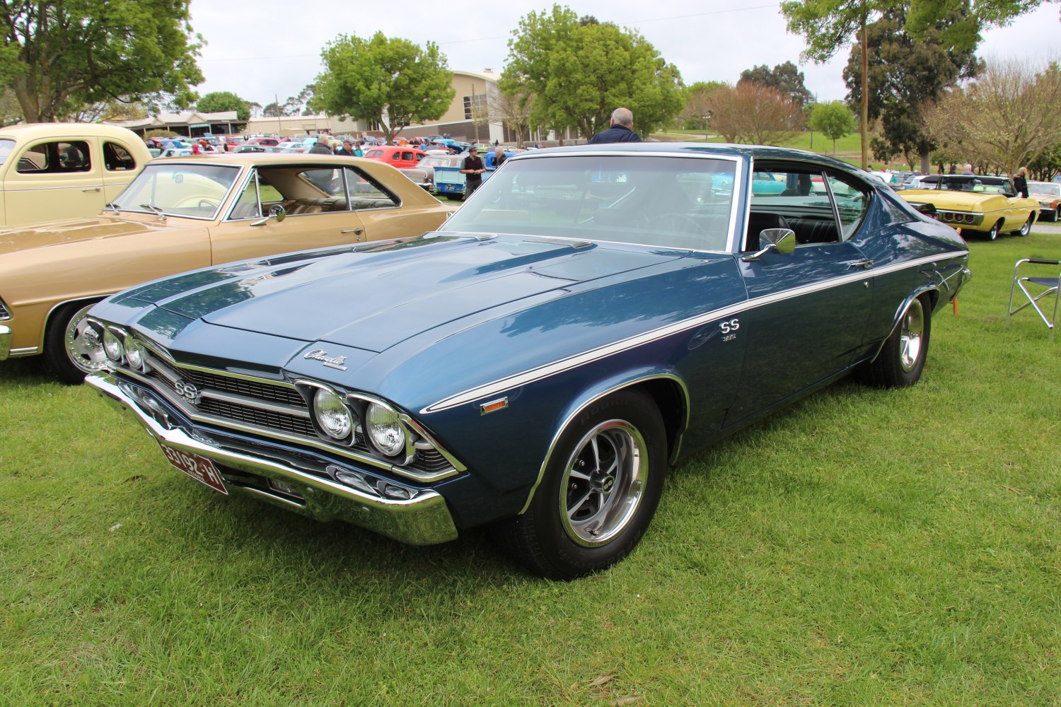 Classic muscle car front grille and side profile with chrome details