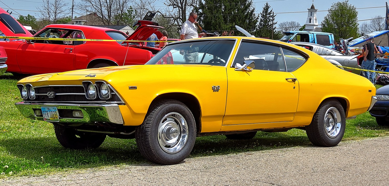 Yellow SS 396 sport coupe with chrome details and classic muscle car design