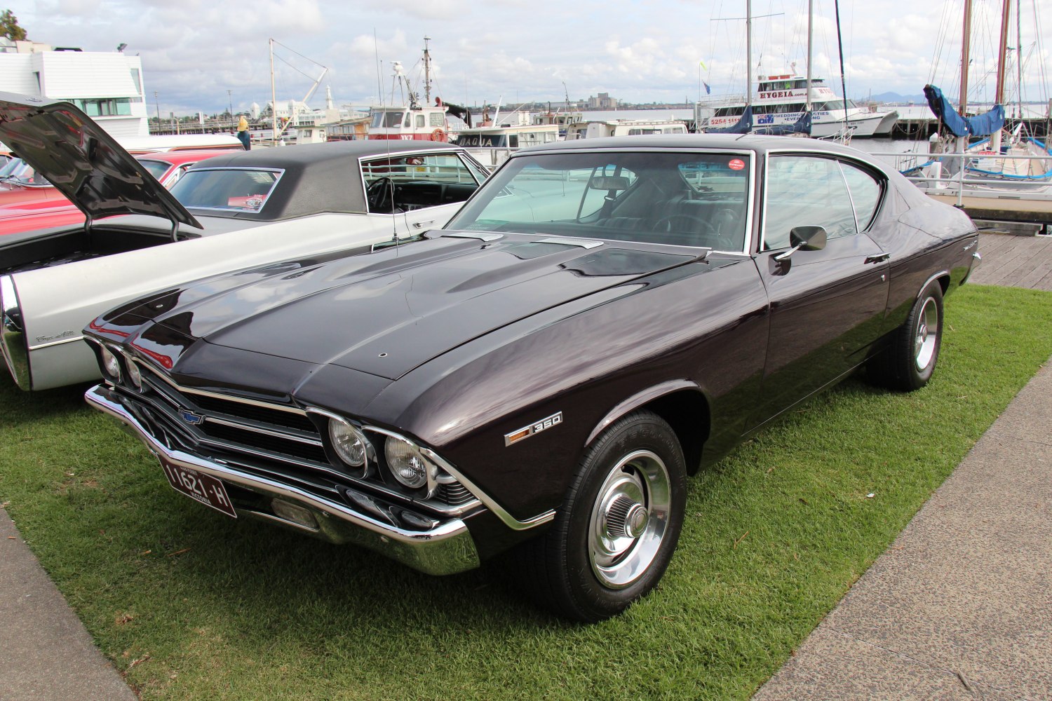 Sleek muscle car with dual headlights and hood scoops