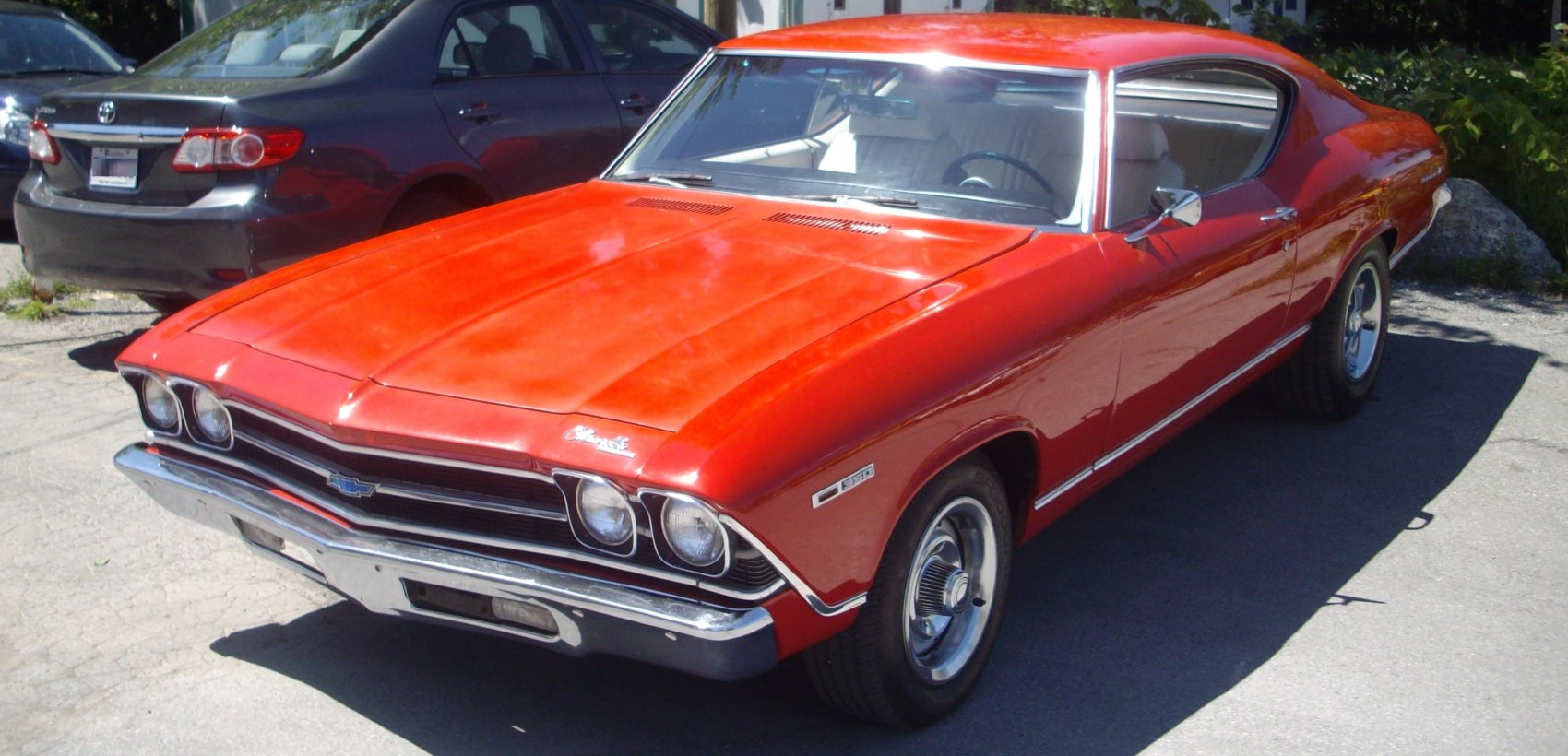 Classic muscle car front with chrome bumper and dual headlights