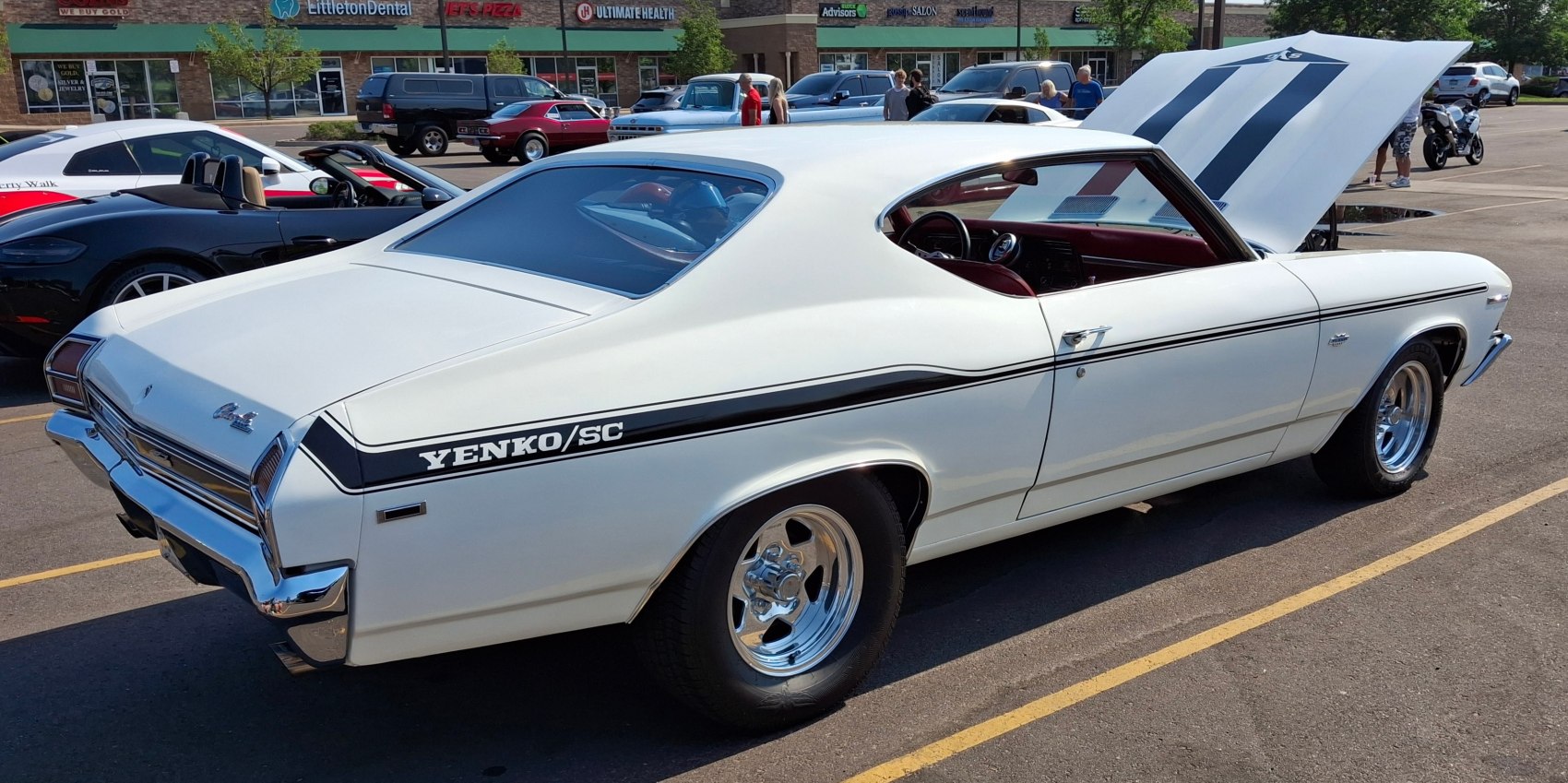 Classic 1969 muscle coupe with distinctive Yenko/SC stripes and polished wheels