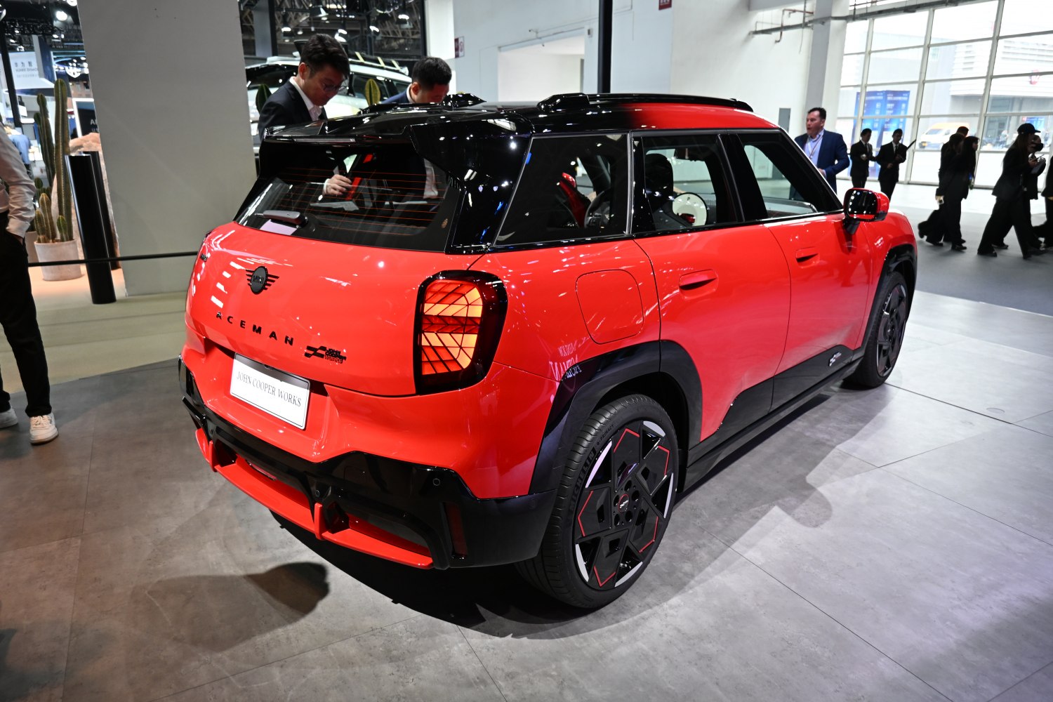 Rear view with sharp taillights and contrasting black roof