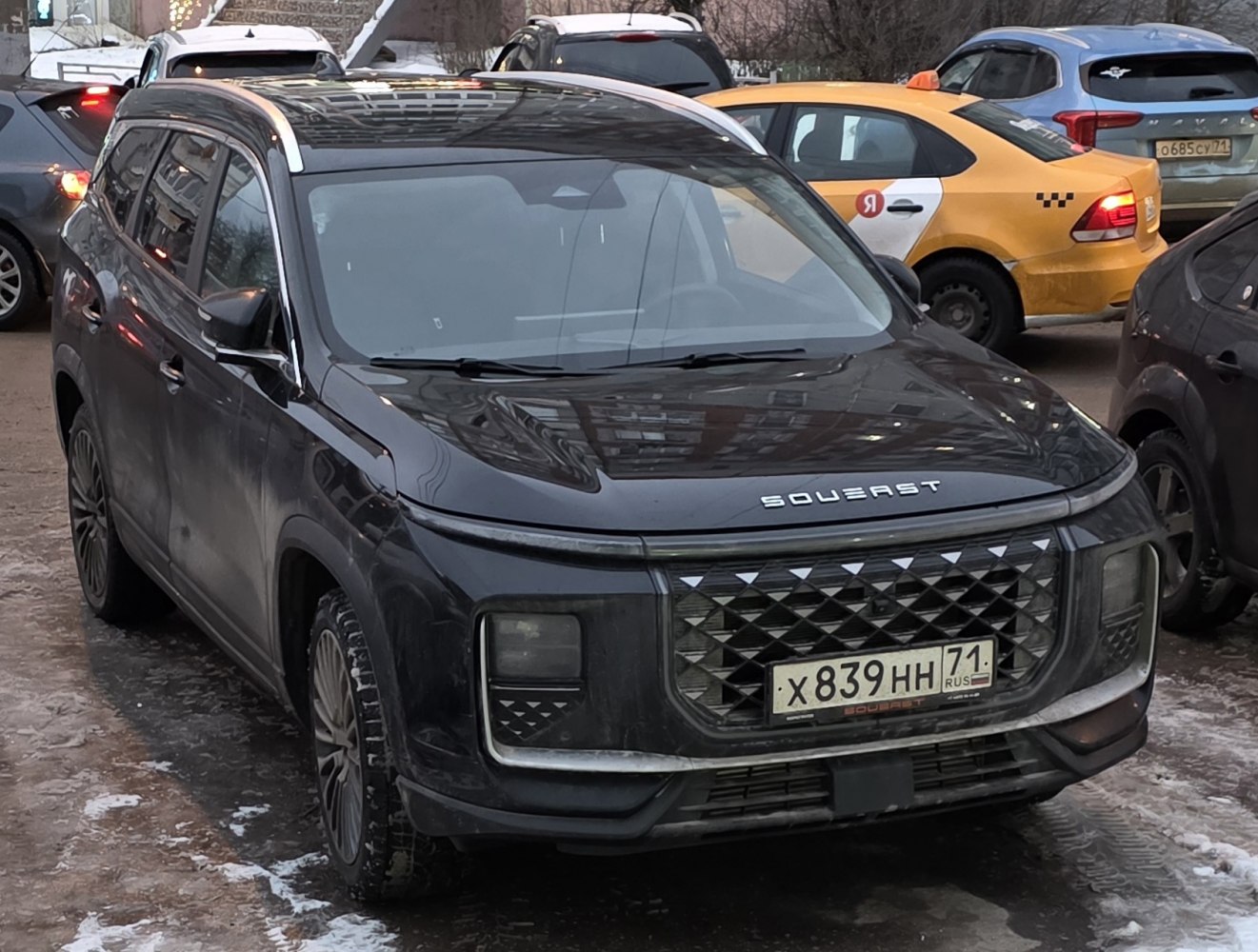 Front view of SUV with diamond-pattern grille and rectangular LED headlights