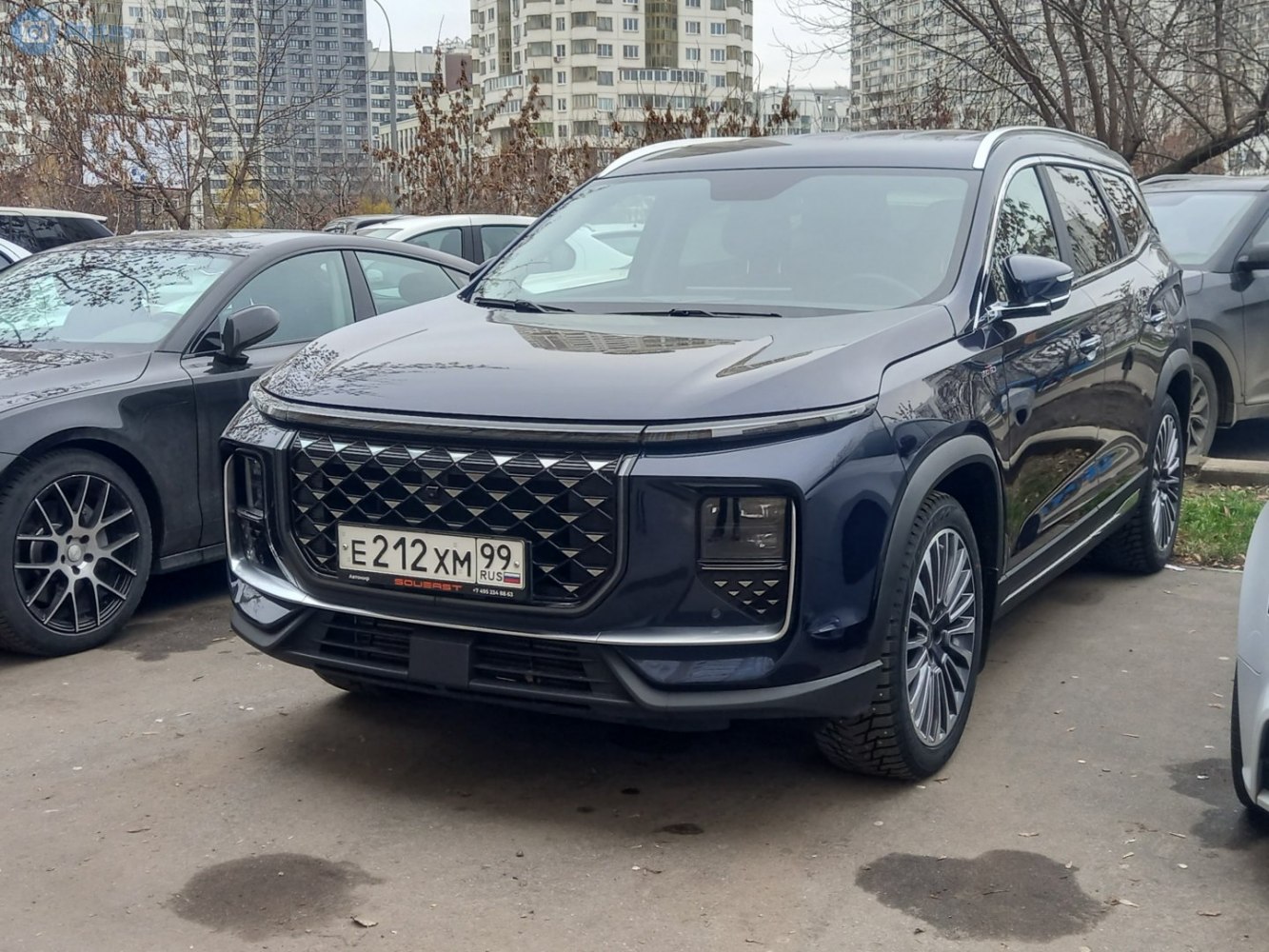 Diamond pattern grille and LED headlights on SUV front.