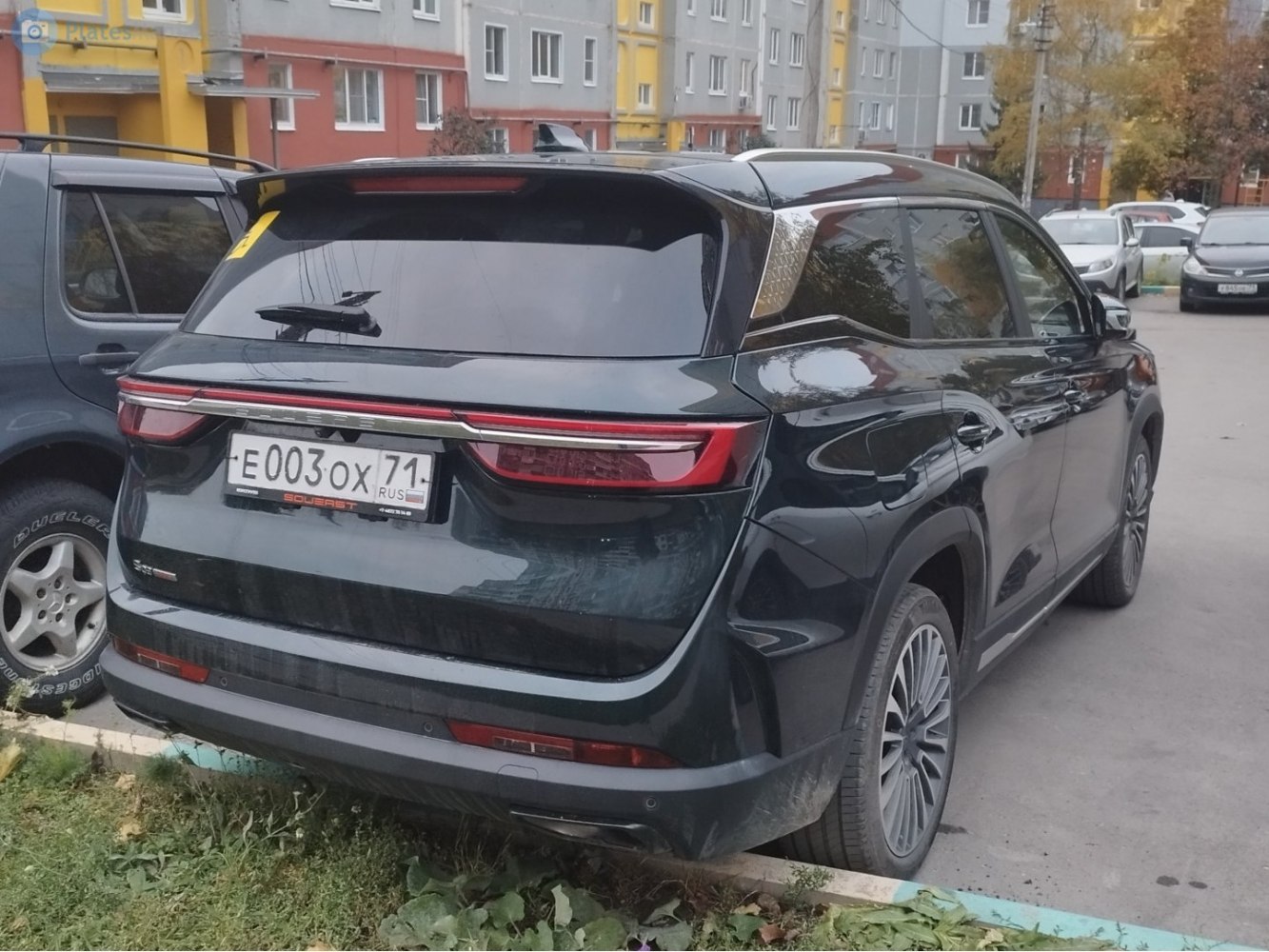Rear view of SUV with sleek LED taillights and rear spoiler