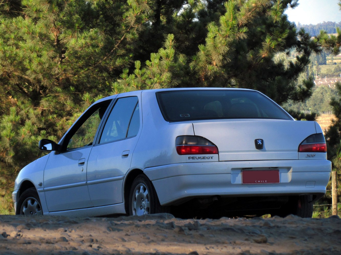 Rear view of facelift sedan with characteristic tail lights and trunk styling