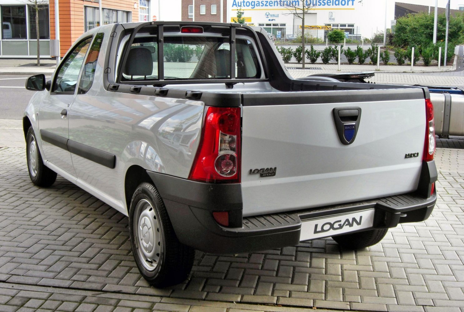 Rear view of a light pickup with cargo bed and tailgate