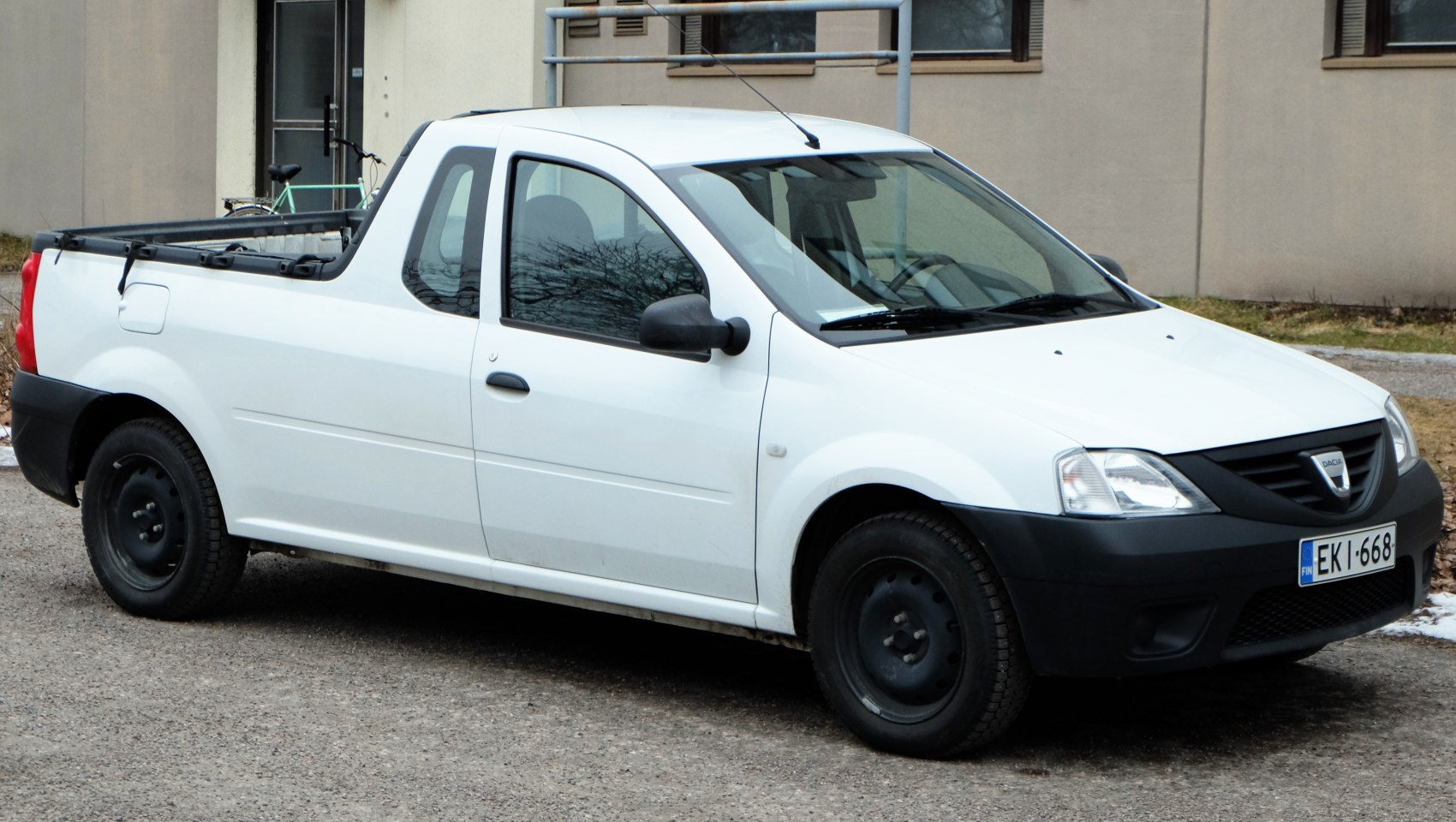 White single cab pick-up truck with open cargo bed and black front trim