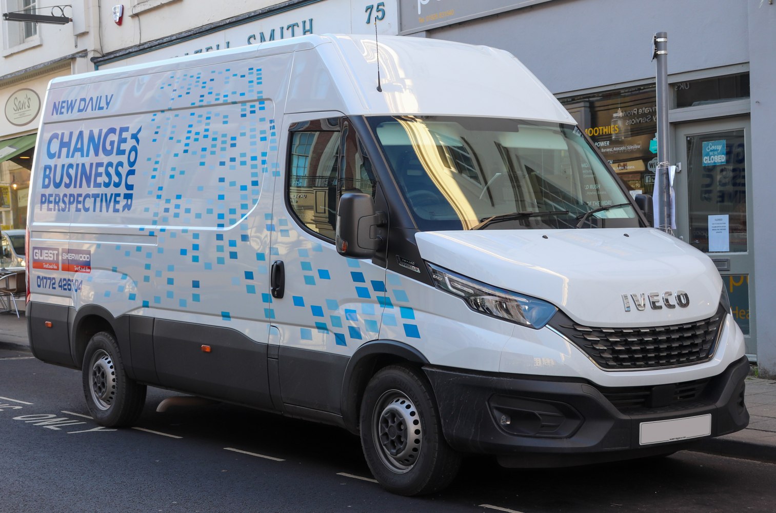 Front and side view of a modern panel van with updated headlights and grille