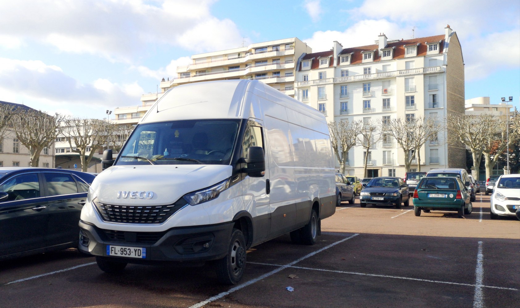 Front view of a large high-roof panel van with distinctive grille and headlights