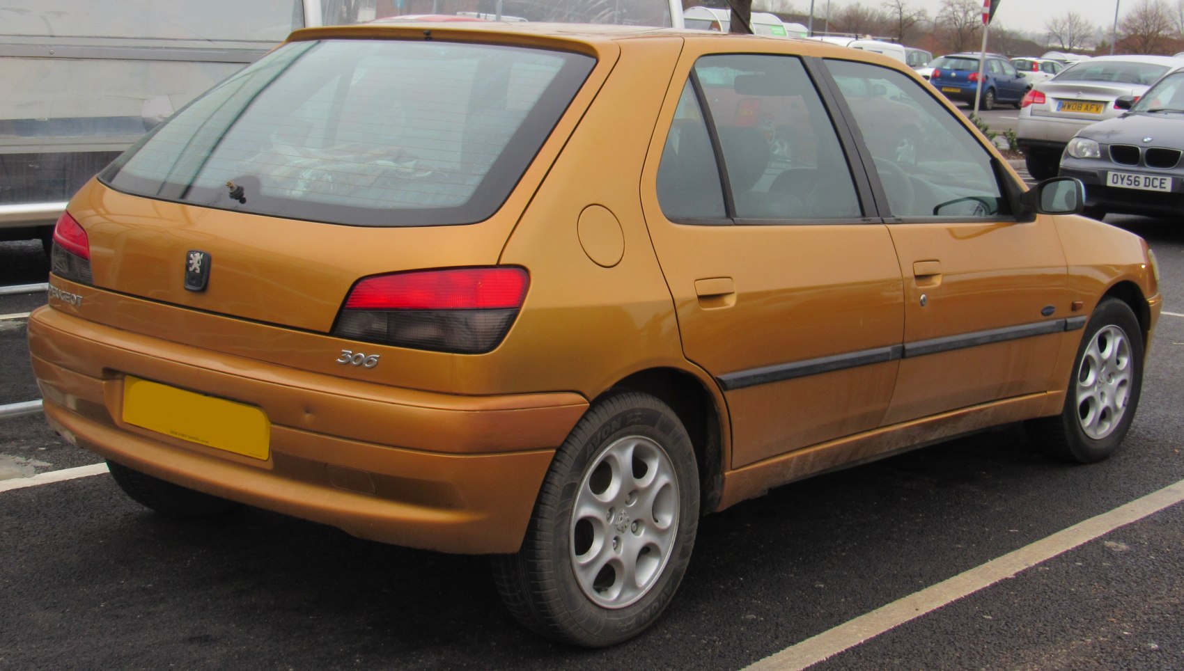Rear and side view with facelift taillights and alloy wheels