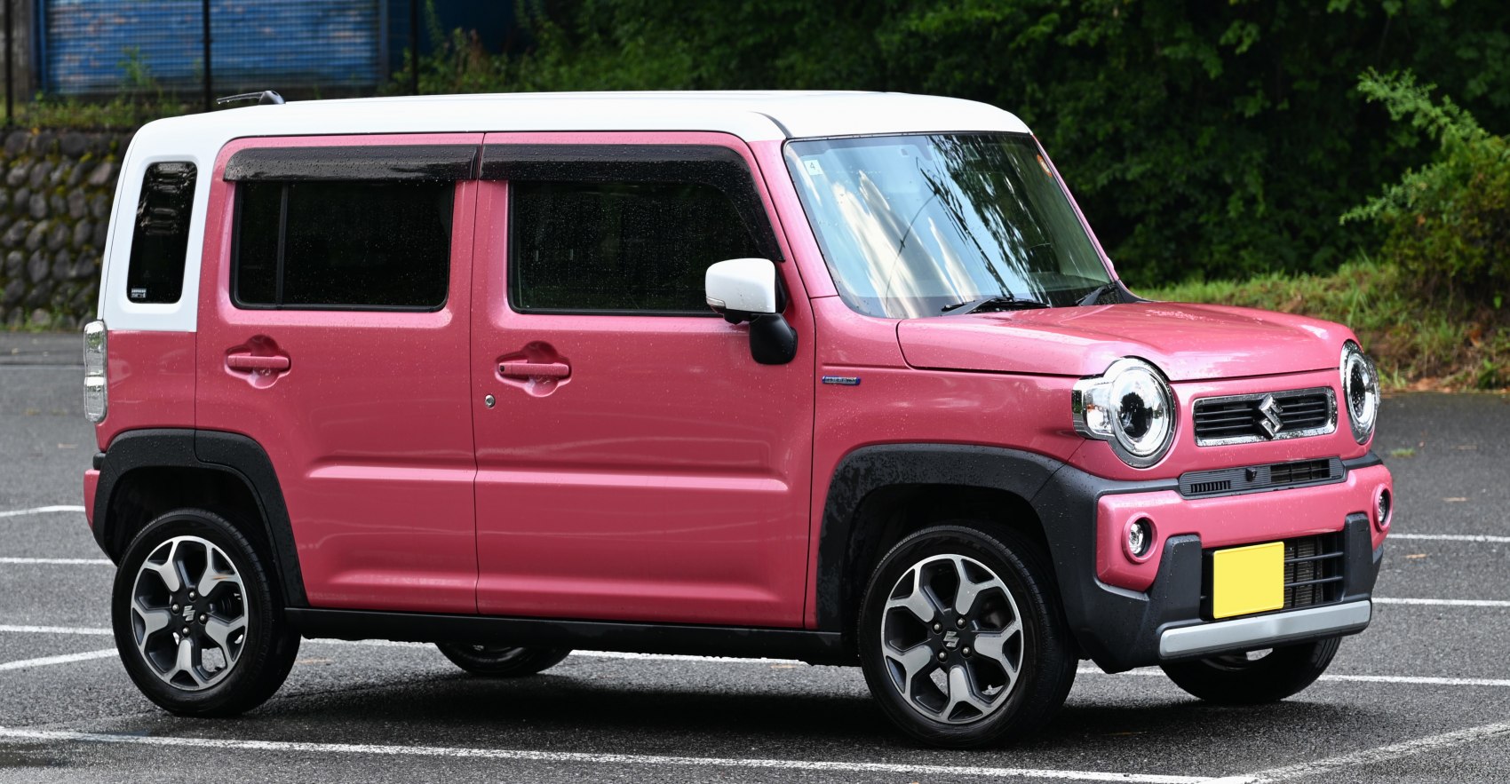 Boxy SUV with round headlights and two-tone roof