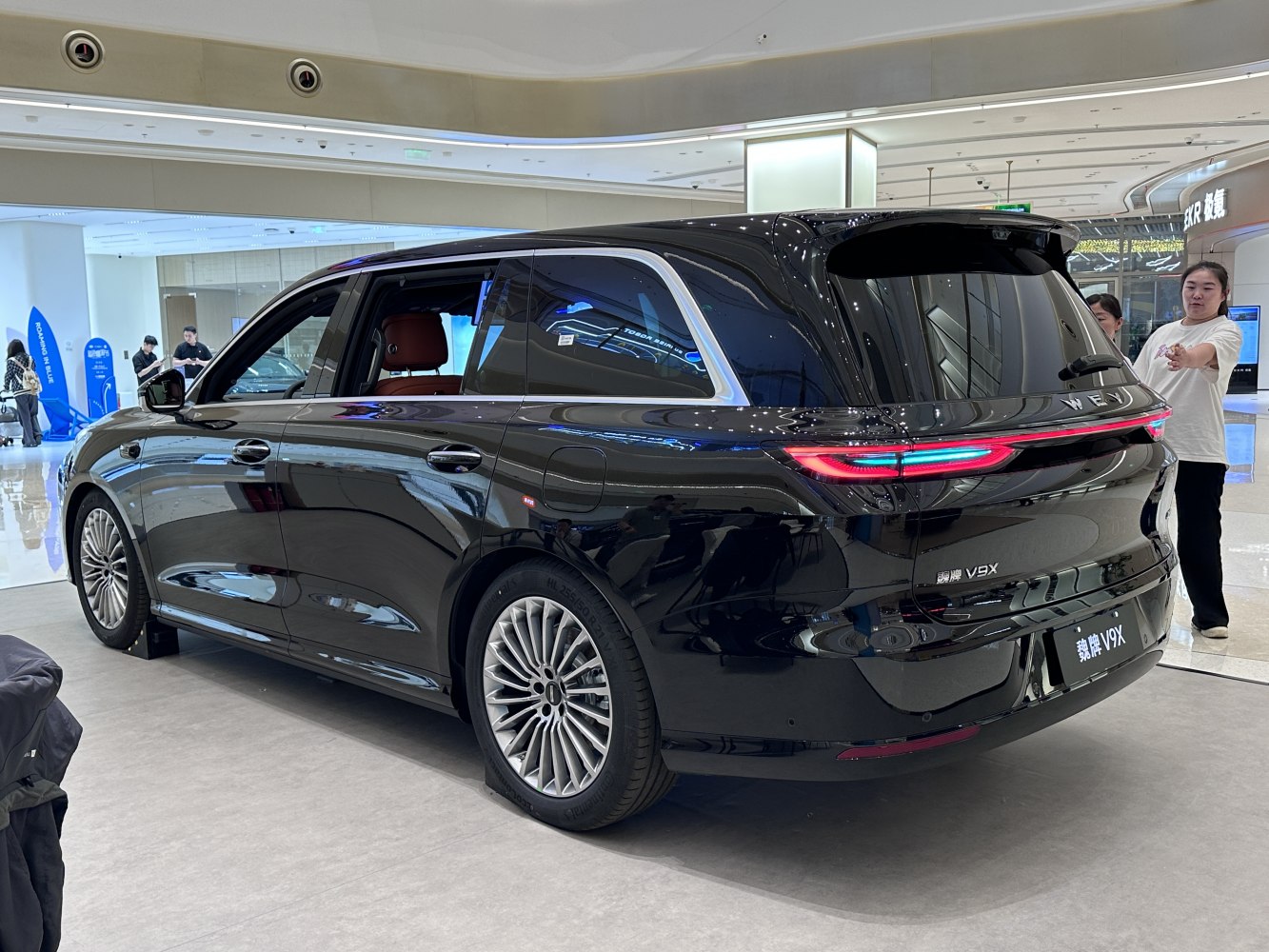 Rear three-quarter view with LED taillights and extended wheelbase design