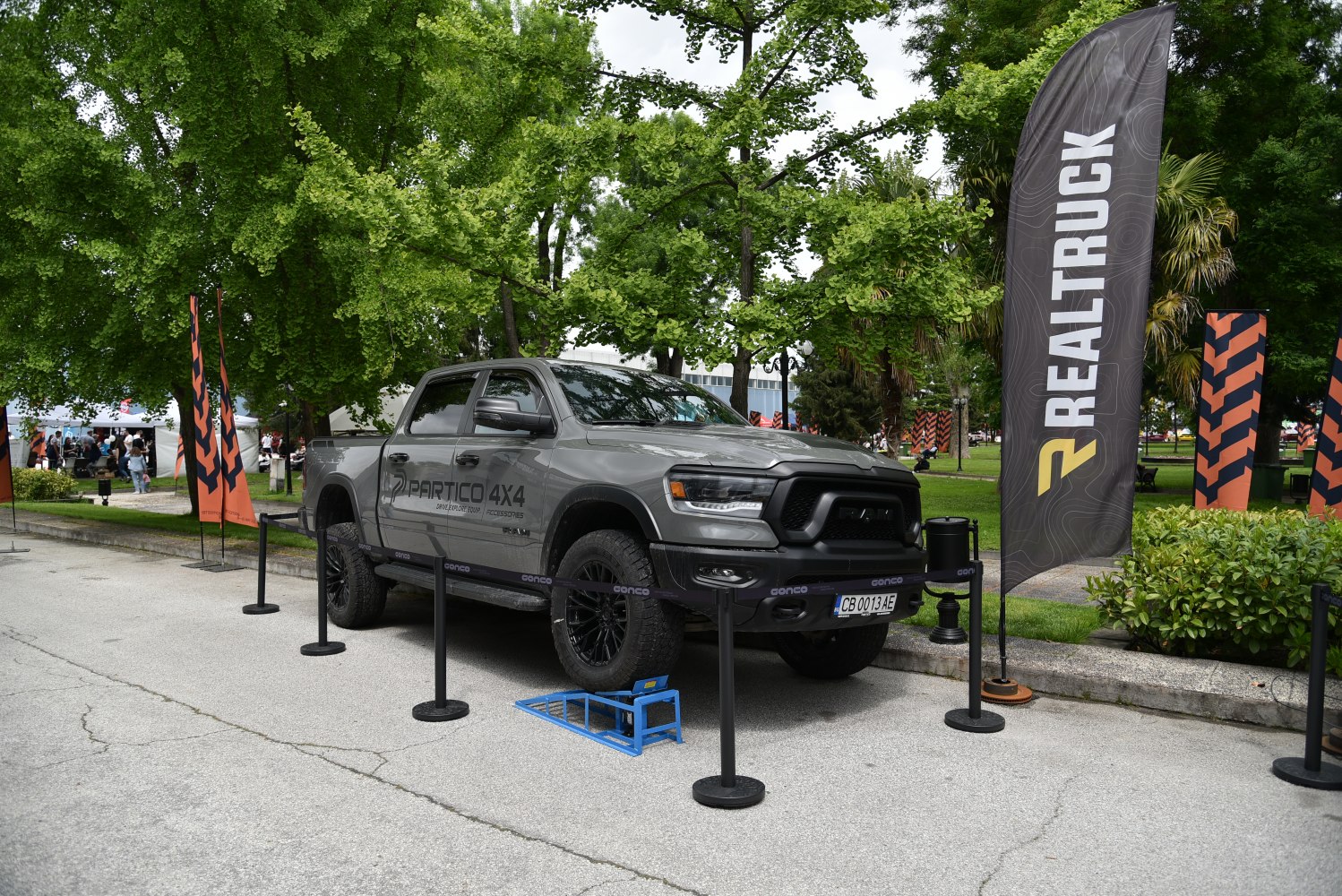 Gray gray 4x4 off-road pickup with rugged tires and bold front design