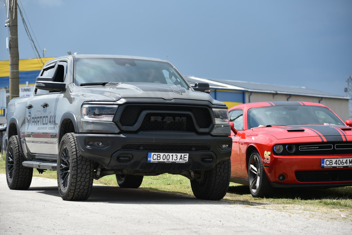 Rugged front grille and aggressive offroad tires on a pickup truck