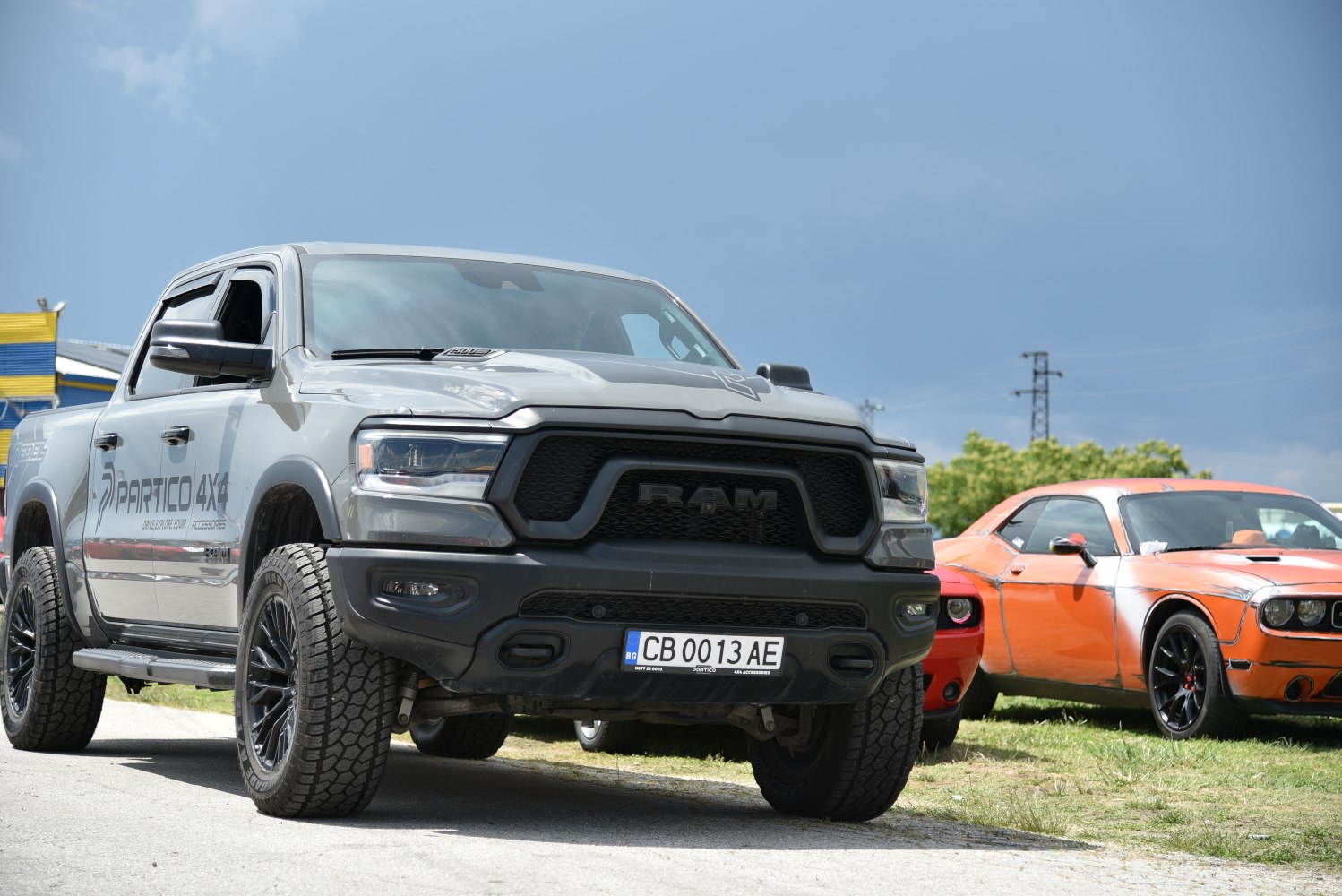 Aggressive front grille and off-road tires on heavy-duty pickup