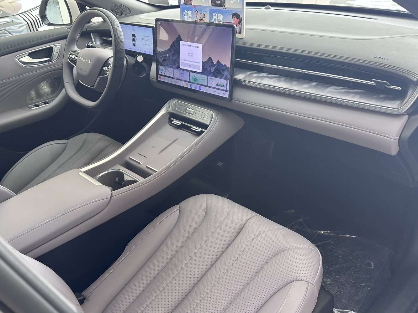 Dual digital displays and leather seats in modern car interior