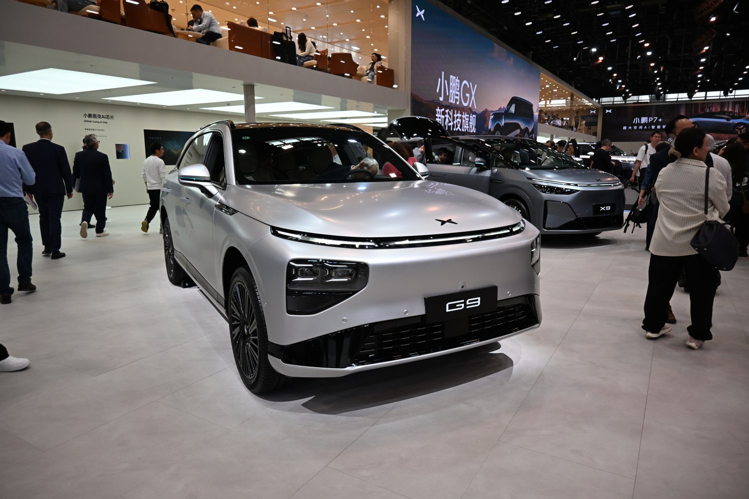Front view of an electric SUV with sleek LED headlights and aerodynamic design.