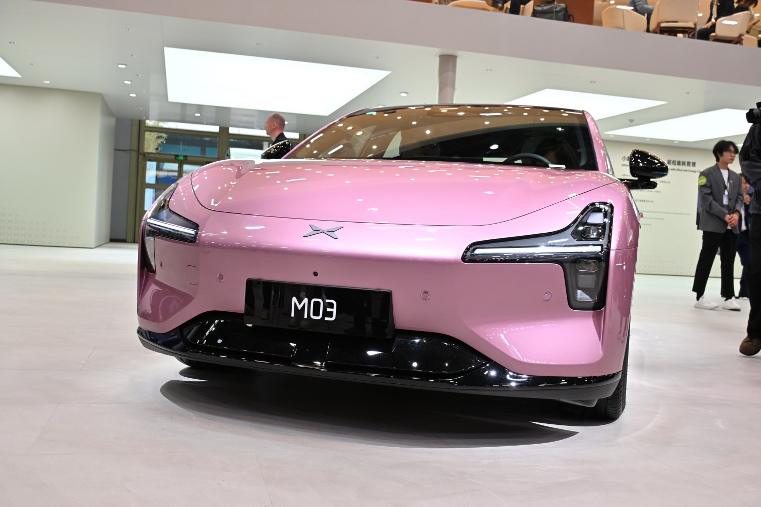Front view of a sleek car with distinctive LED headlights and smooth aerodynamic design