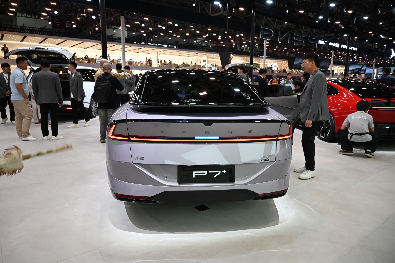 Sleek rear view with continuous LED tail light strip and smooth modern design.