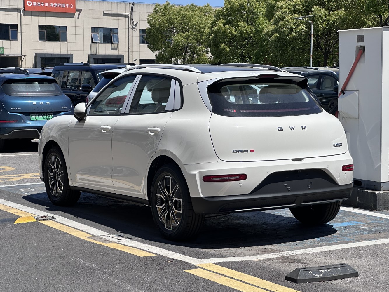 Rear view of a white hatchback with alloy wheels and aerodynamic styling