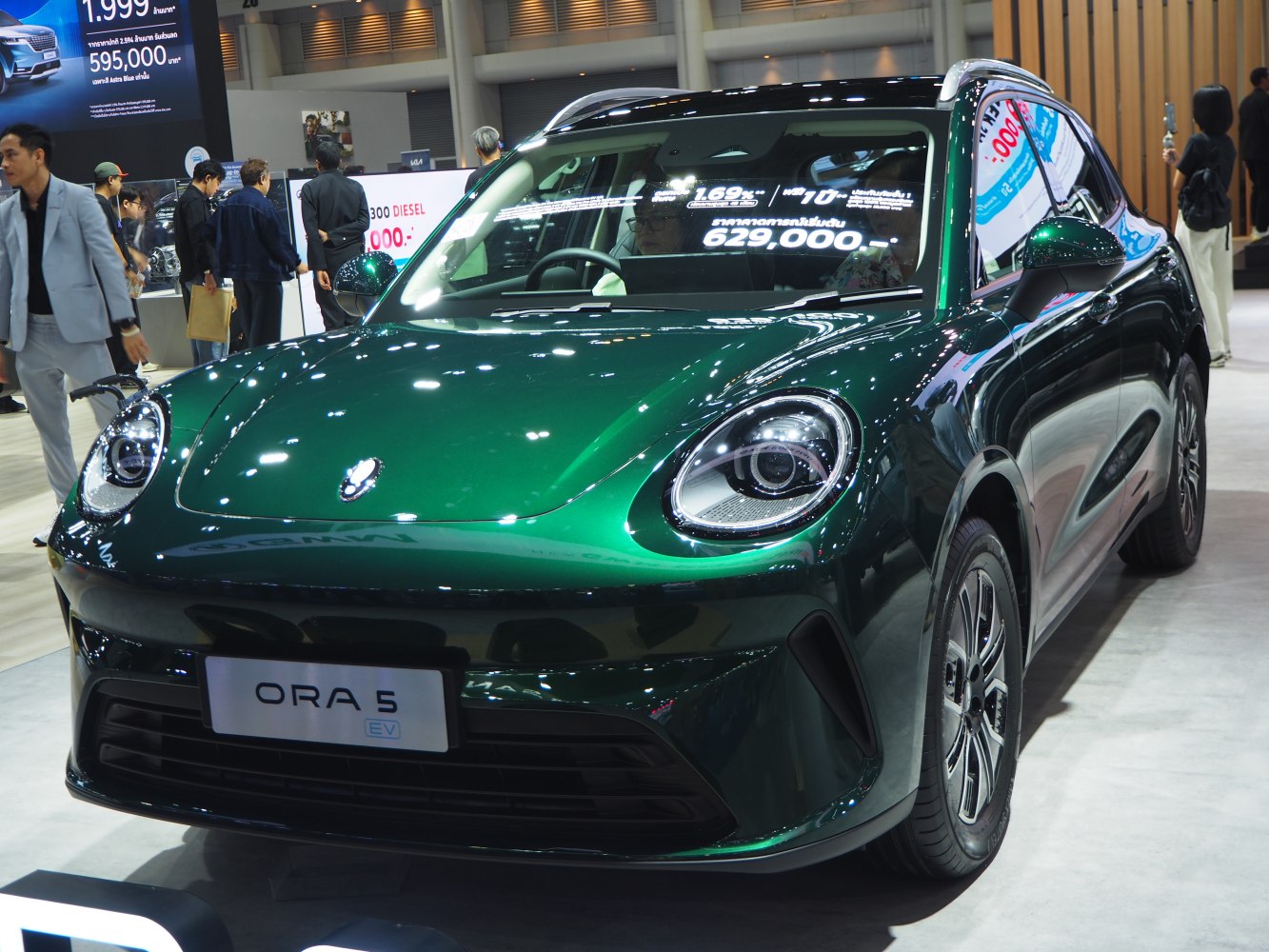 Sleek front view with distinct round LED headlights and aerodynamic curves