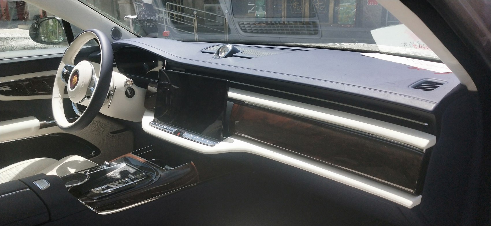 Digital display with wood trim and luxury steering wheel
